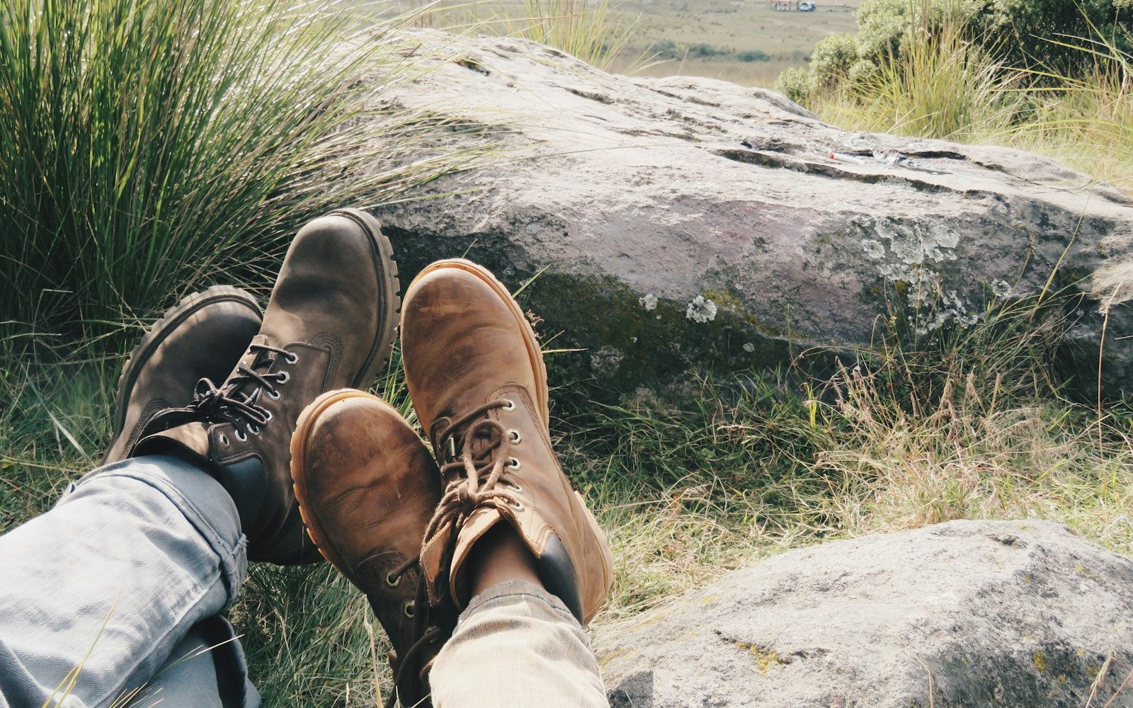 men wearing pair of brown and gray work boots